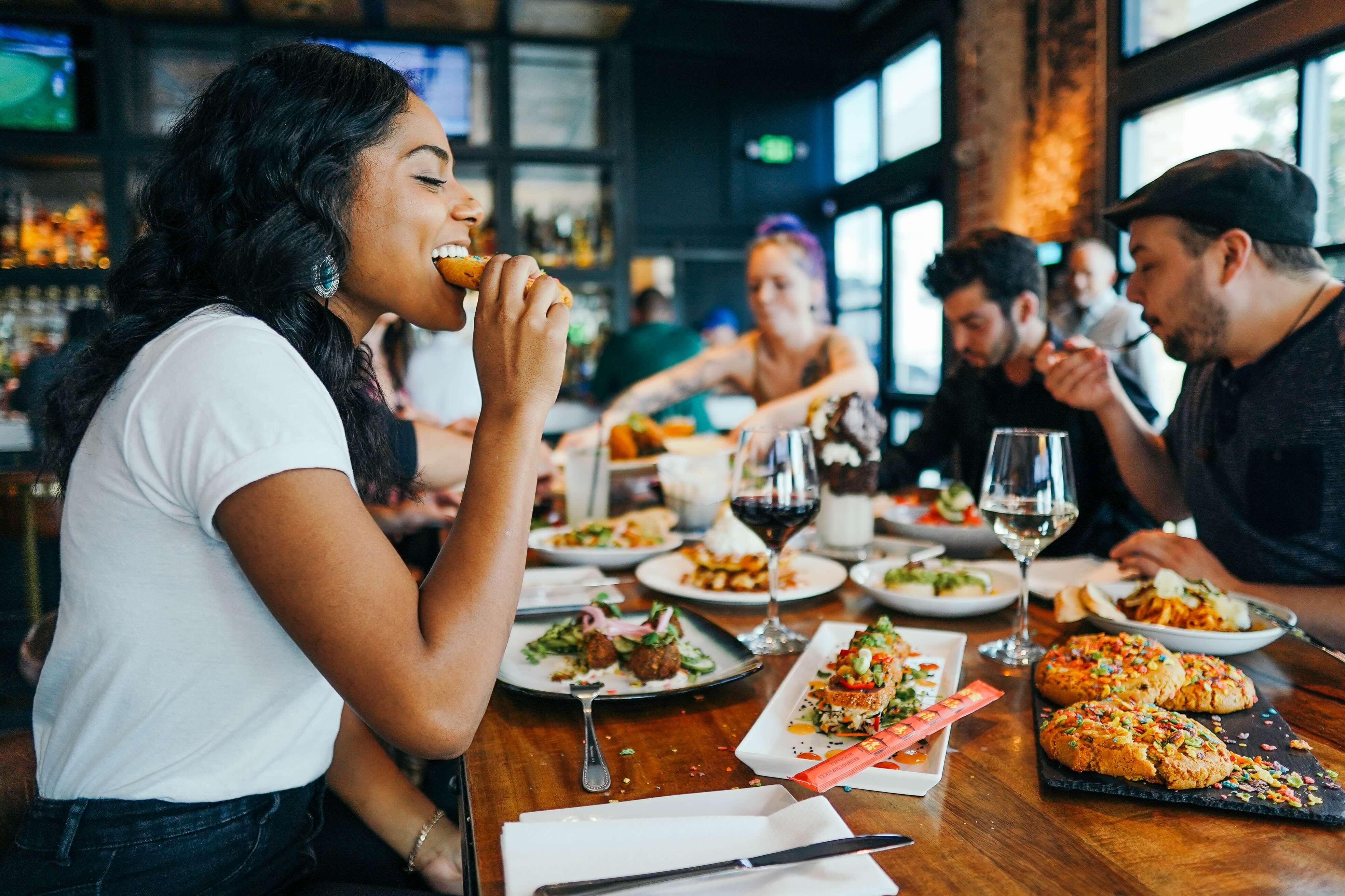 Group eating food in restaurant