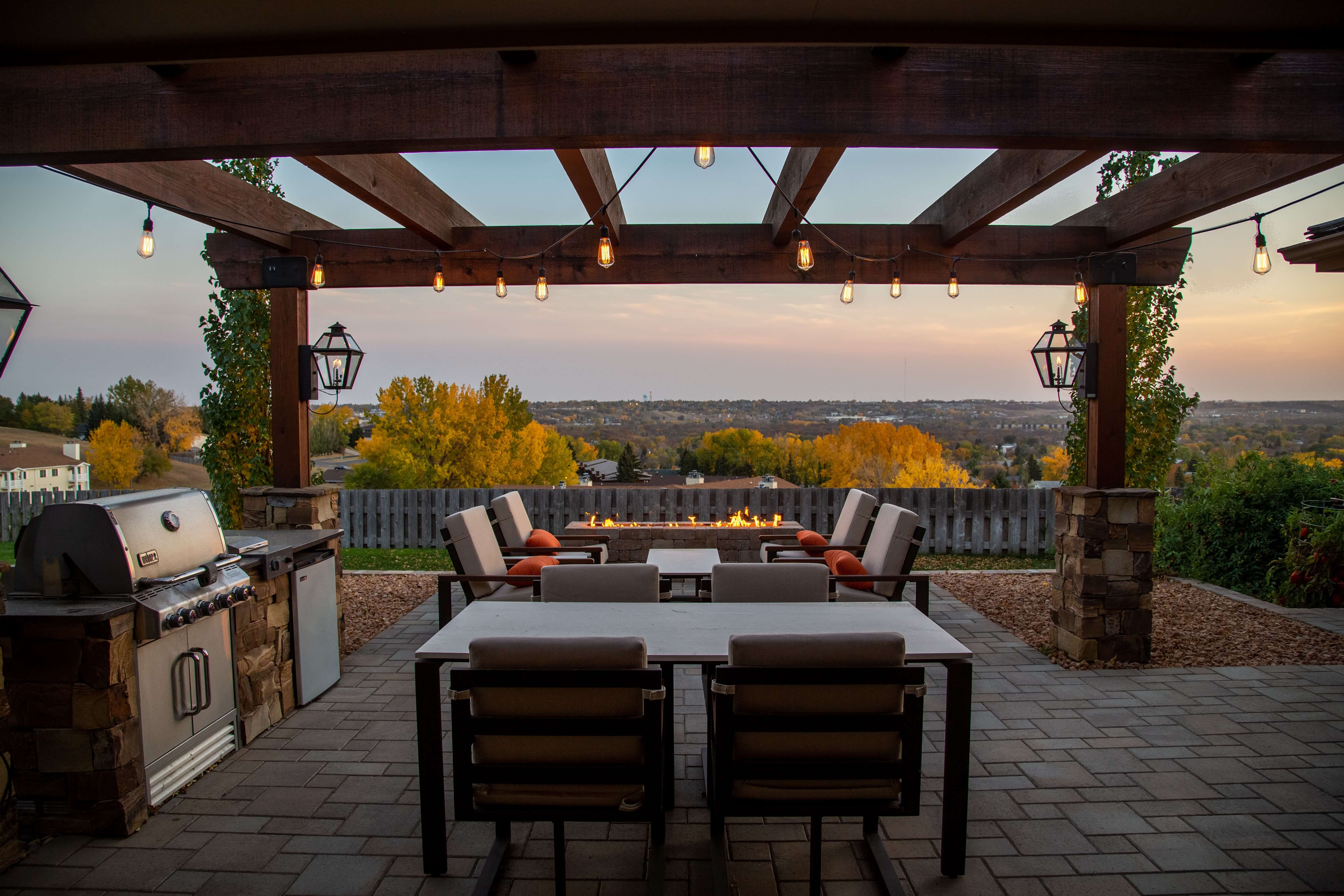 Outdoor patio with fire pit and dining area