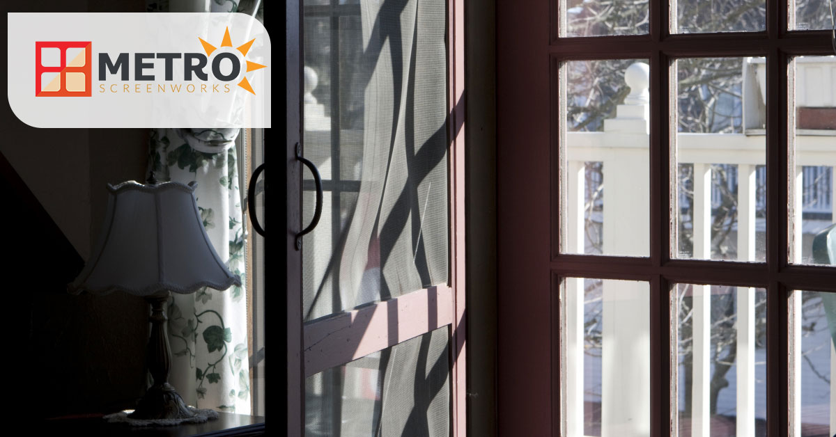 An open window overlooking a porch and the Metro Screenworks logo