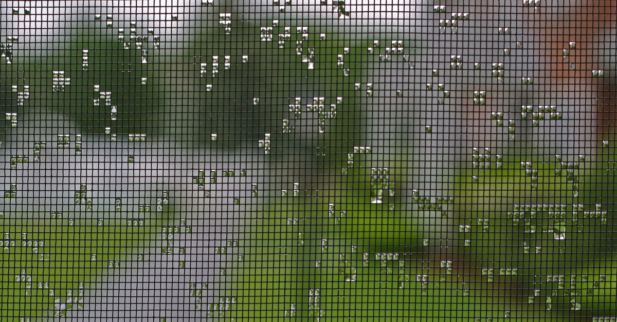 Screen mesh with water droplets in the mesh