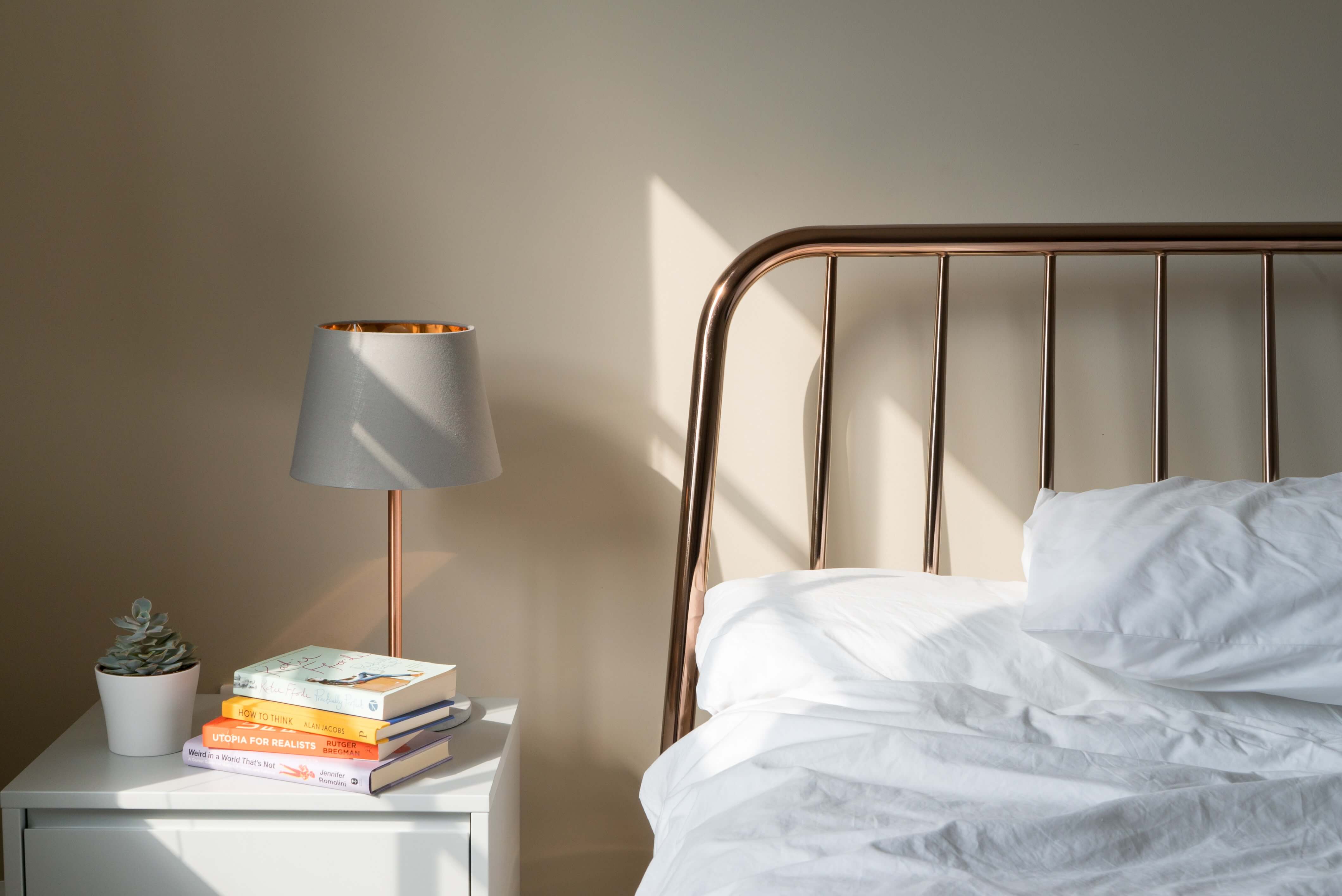 Bed with sunlight shining on it