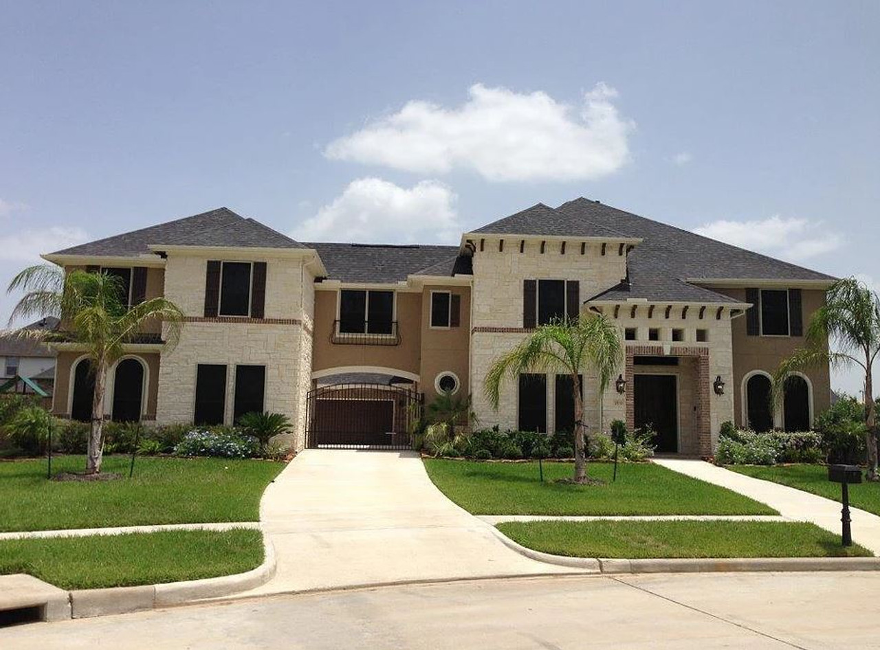 Coastal home with black stainless steel window screen