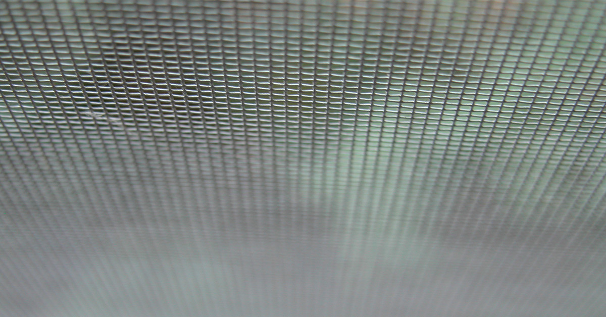 Window screen mesh on a green background