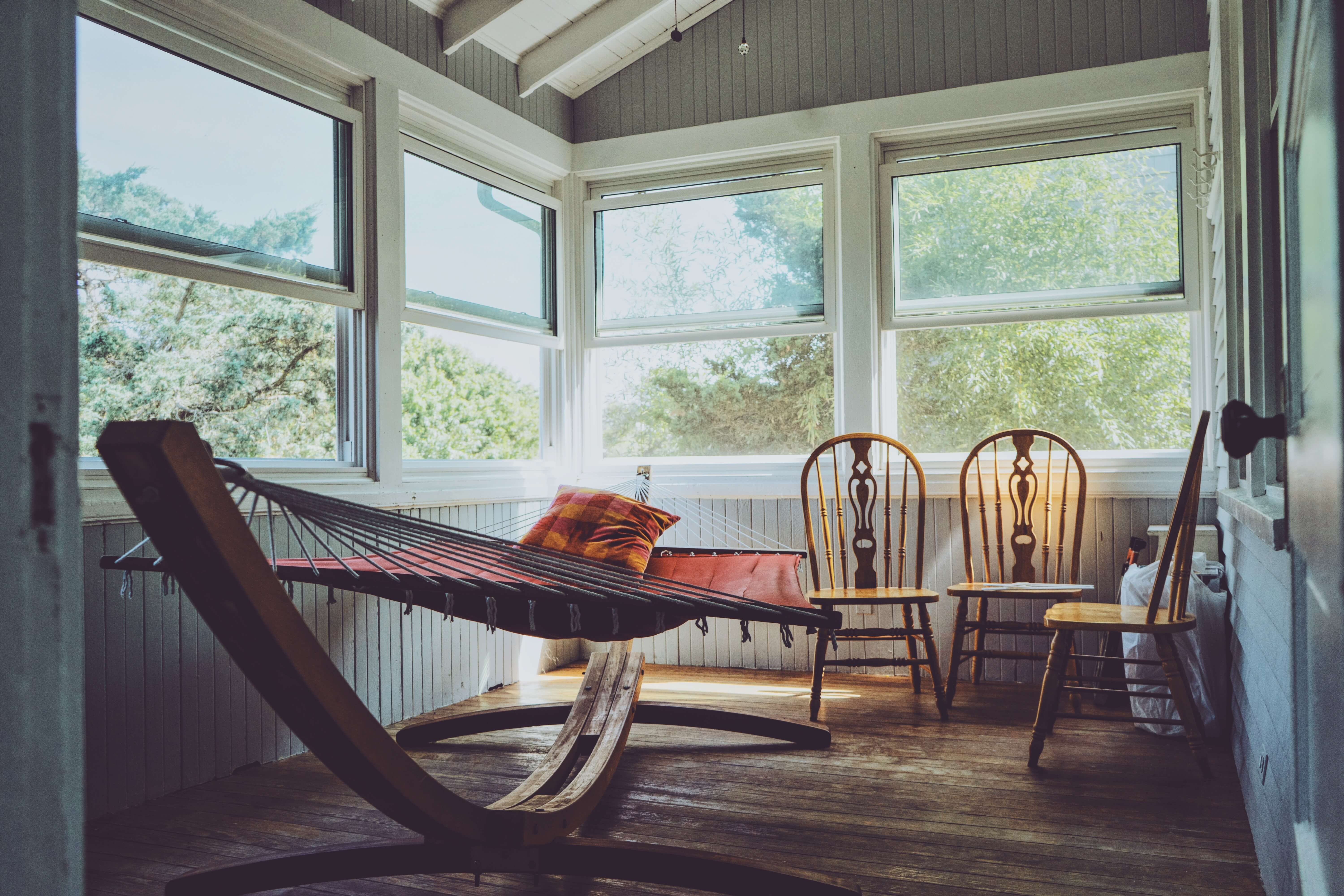 Florida room with hammock and soft lighting