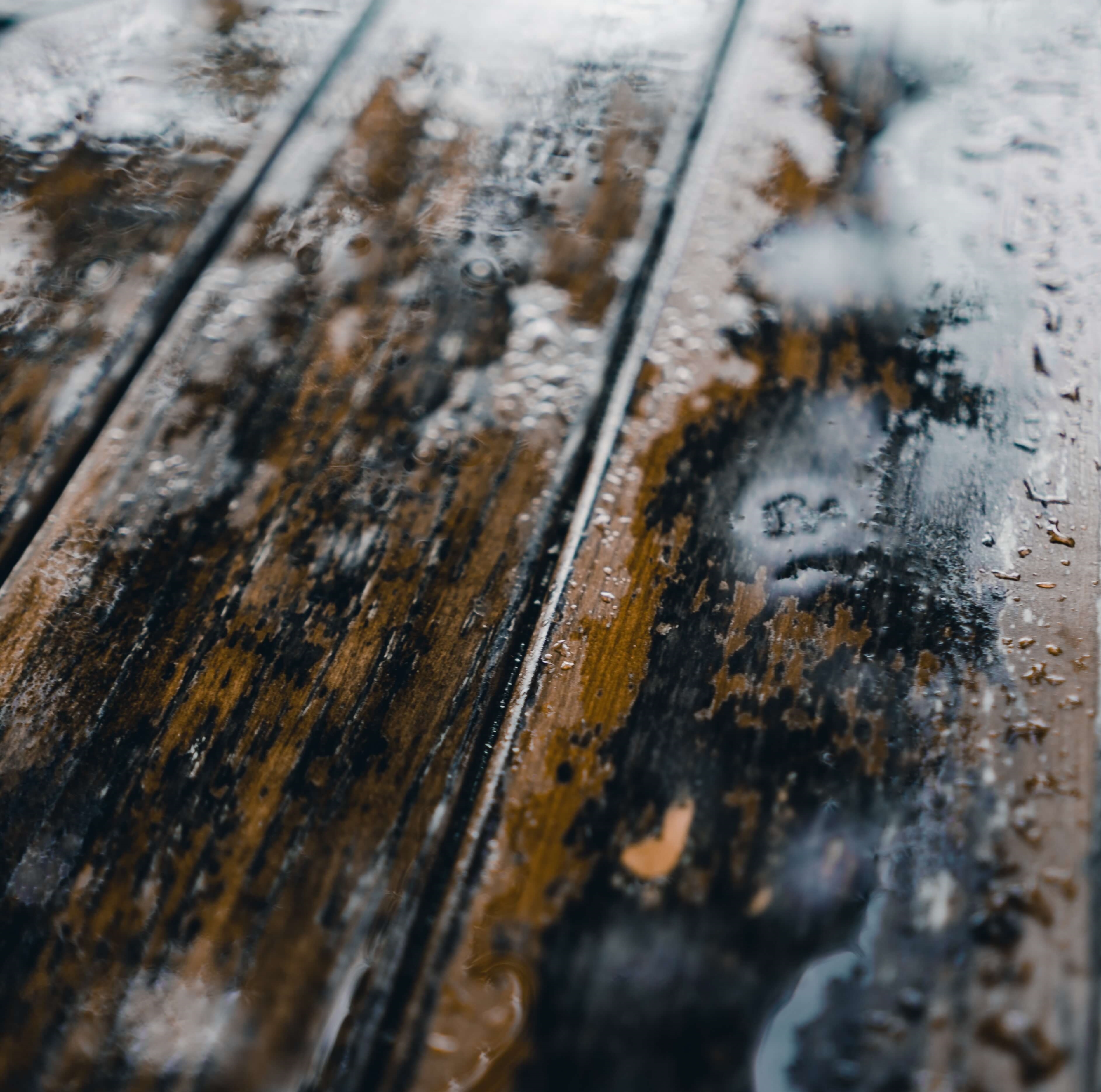 Water pooling on a wooden deck