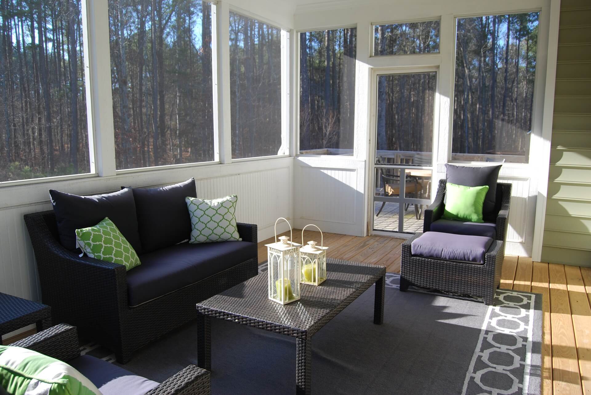 Large sunroom with windows and couches