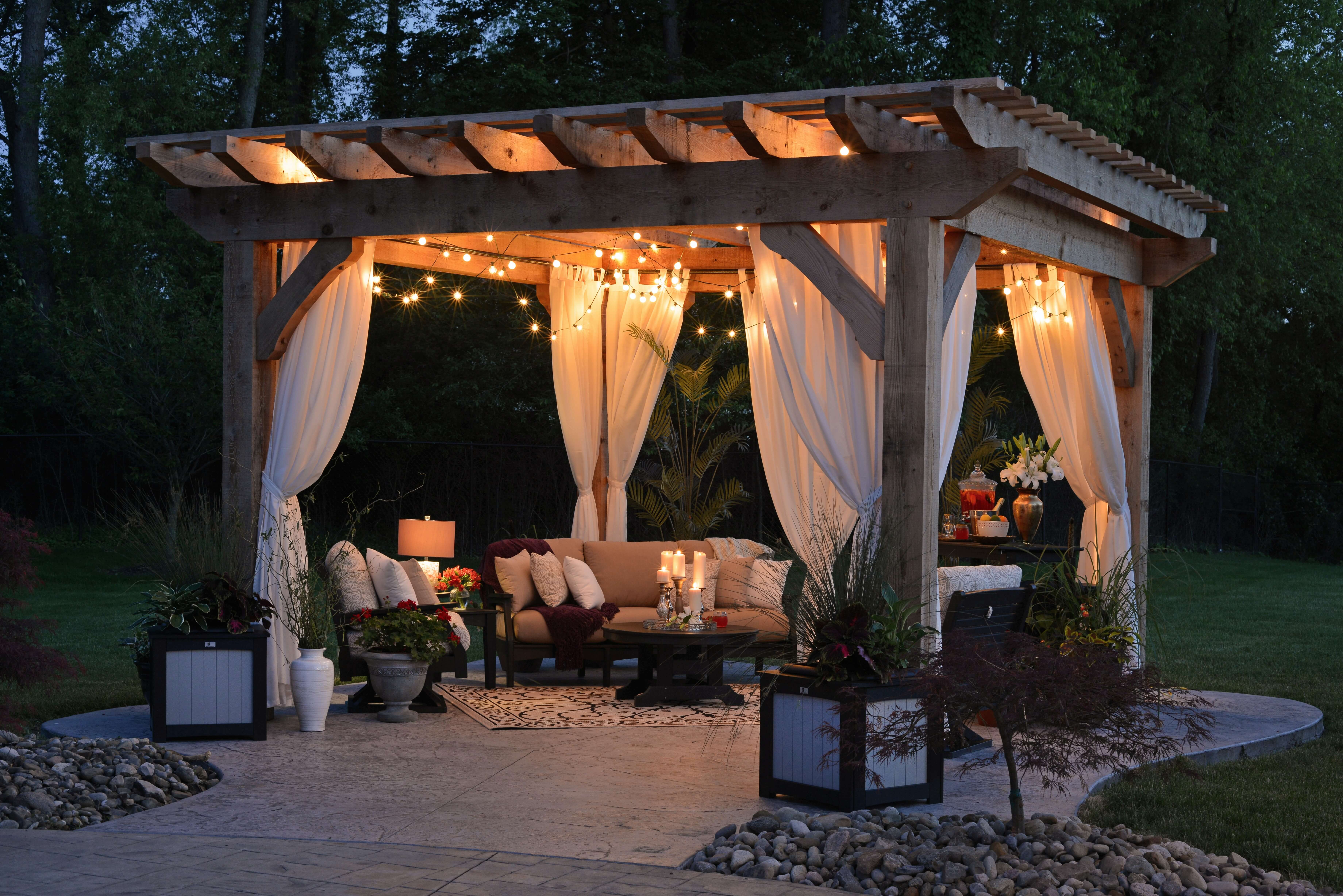 Gazebo structure with lighting and furniture