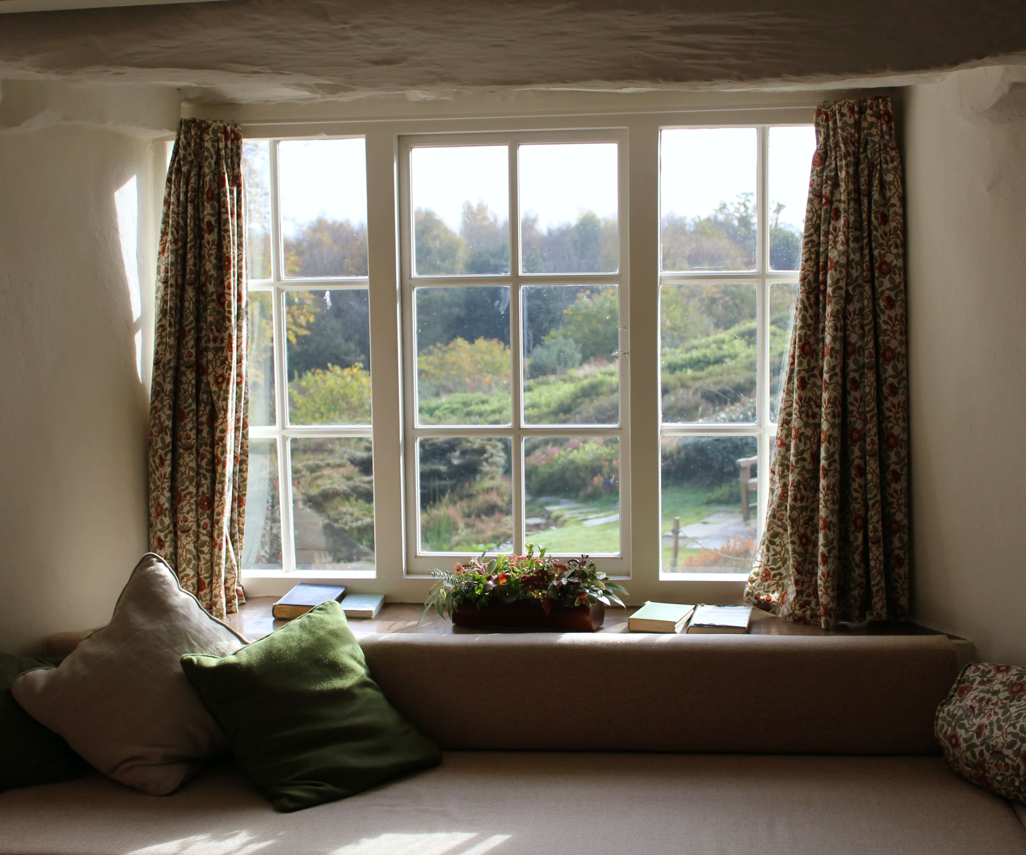 Picture window overlooking rolling hills