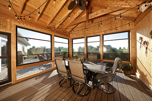 Wood-finished sunroom with dining nook